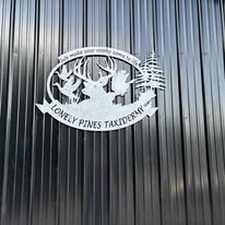 Lonely Pines Taxidermy metal shop sign
